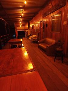 a living room with a couch and a table at EL DORADO POUSADA in Barcelos