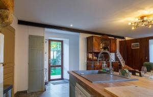 a kitchen with a sink and a counter top at La maison d'anna in Langogne