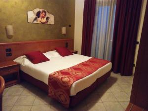 Postel nebo postele na pokoji v ubytování Hotel Residence Eden