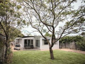 a house with a tree in the yard at Lonsdale on Glaneuse in Point Lonsdale