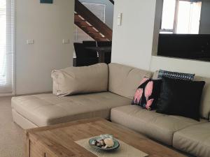 a living room with a couch and a coffee table at Lonsdale Shores in Point Lonsdale