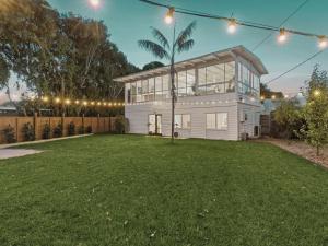 a house with a lawn in front of it at The Springs in Point Lonsdale