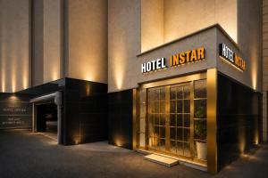 a hotel institute sign on the side of a building at Instar Hotel in Suwon