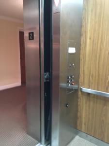 an elevator in a building with the number two at Colts Neck Inn Hotel in Colts Neck +72 photos