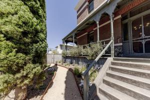 a house with stairs leading to the front door at QPO Queenscliff in Queenscliff