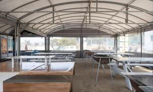 a group of tables in a room with a tent at Taean Manripo Feel Hotel in Taean