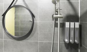 a mirror on a wall in a bathroom at Taean Manripo Feel Hotel in Taean +41 photos
