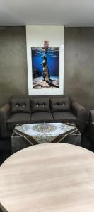 a living room with a couch and a table at Hana hostel in Labuan Bajo