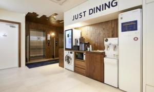 a kitchen with a washer and dryer at JustSleep Namyangju Dasan in Namyangju +40 photos