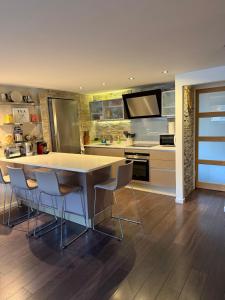 a kitchen with a table and chairs in a kitchen at Appartement Loft Cannes in Cannes