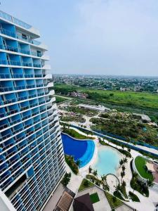 an aerial view of a large building and a resort at Azure North MiCasa in San Fernando