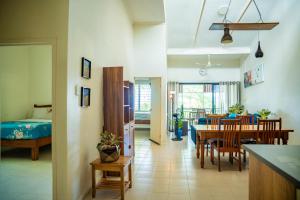a kitchen and dining room with a table and chairs at seaview apartment in Honiara +17 photos