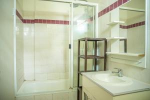 a bathroom with a sink and a shower at seaview apartment in Honiara