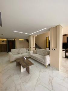 a living room with couches and a coffee table at Jasmine Resort Complex in Sharm El Sheikh