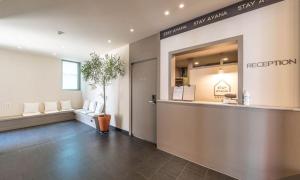a waiting area of a salon with a reception counter at HOTEL STAY AYANA DAEJEON in Daejeon