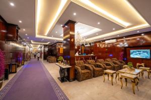 a lobby of a hotel with couches and a bar at راحتي هنا للشقق المخدومة 7 in Riyadh