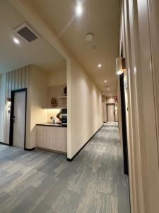 an empty hallway with a kitchen in a building at Hotel Mirda Puncak Alam in Bandar Puncak Alam