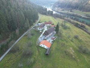 an aerial view of a group of houses in a field at Apartmaji pri Mojci in Podvelka +9 photos