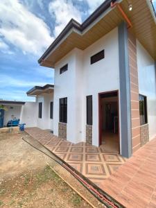 a houserendering of a home with a large patio at Isla Del Mar Villas in Panglao Island
