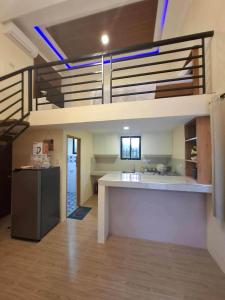 a kitchen with a loft bed in a room at Isla Del Mar Villas in Panglao Island