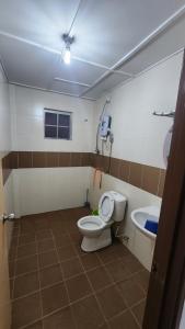 a bathroom with a toilet and a sink at The Gladiator Homstay in Brinchang +88 photos