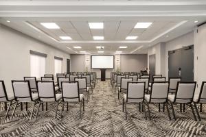 a conference room with chairs and a projection screen at Hyatt Place Santa Fe in Santa Fe +71 photos
