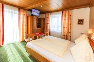 Krevet ili kreveti u jedinici u okviru objekta Alpenhotel Tauernstüberl