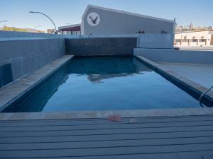 a swimming pool on the roof of a building at 77 ON Independence Avenue in Windhoek