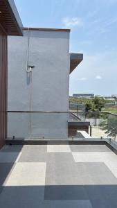 a view of a building with a tile floor at Md Couple Stay in Covelong +9 photos