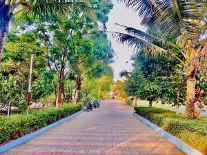 a cobblestone street with two motorcycles parked on it at New Central villa in Bapsai +2 photos