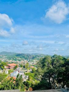 a view of a city with trees and buildings at Villa Avora Ridge in Kandy