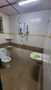 a bathroom with a toilet and a sink at Muslim homstay@Crown Imperial Court in Cameron Highlands +120 photos