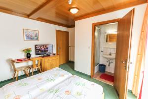 Krevet ili kreveti u jedinici u okviru objekta Alpenhotel Tauernstüberl