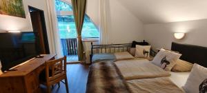 a living room with a couch and a table at Appartements Alpengarten in Mallnitz