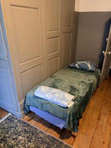 a room with a bed with two pillows on it at Gengoult 1 in Toul