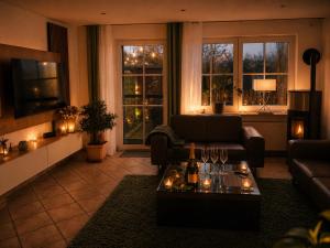 a living room with a couch and a table at Reeser Schatzkästchen in Rees