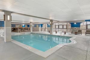 a pool with blue water in a building at Hampton Inn & Suites Augusta West in Quail Creek