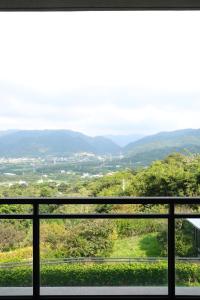 a view of the mountains from a balcony at Tao Ye BnB in Miaoli