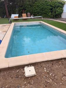 a swimming pool in a yard with at L instant dore spa privatif in Cavaillon