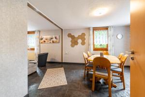 a dining room with a table and chairs at Ferienhaus Mayer in Idar-Oberstein
