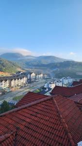 a view of a city with houses and roofs at Merlin Home@Crown Imperial Court in Tanah Rata