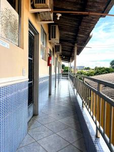 a balcony of a building with a walkway at Hotel Independência Executive in Goiânia
