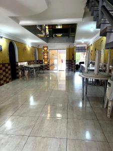 a room with tables and chairs in a building at Hotel Independência Executive in Goiânia +21 photos