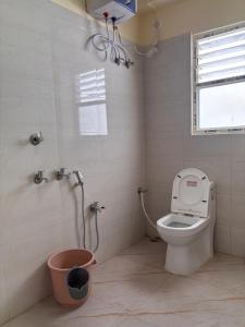 a bathroom with a toilet and a shower at Spring Valley Homestay Rishop in Rishop +20 photos