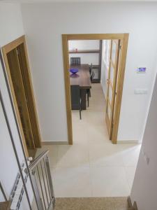 a hallway with a dining room and a table at Andreamar in Cambados +74 photos