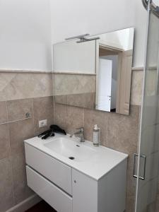 a bathroom with a white sink and a mirror at Hotel Alex in Florence +68 photos