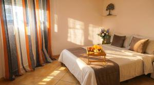 a bedroom with a bed with a tray of fruit on it at Apartment Segura 2BD in Rojales