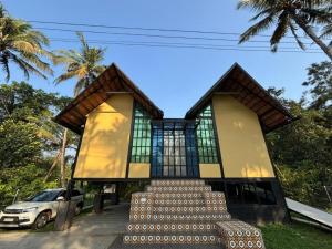 a building with a staircase in front of it at Casa Kabani Resort in Chegāt