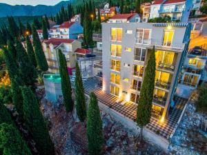an aerial view of a building with trees at Apartments Didan in Cavtat