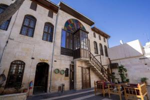 a building with a rainbow on the side of it at Beliz Hanım Konakları in Gaziantep